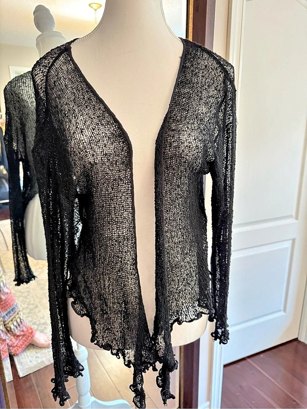 Black Open Front Cardigan Like New. Is small, but the material is very forgiving